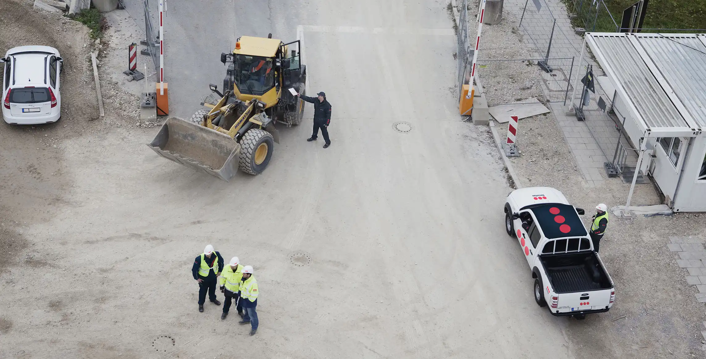 An officer communicates with a construction worker